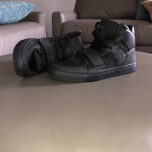Creative Recreation black high top sneakers.